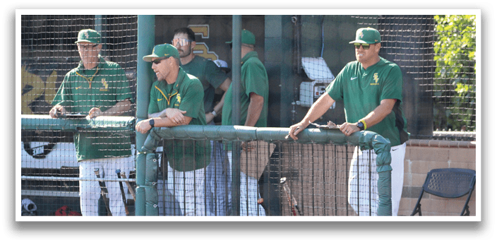 Baseball players in green uniforms are standing on the field. AI generated content