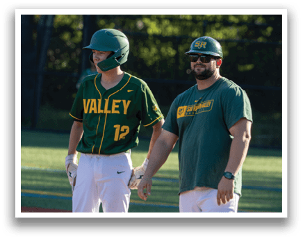 Two men wearing green and yellow baseball uniforms are standing on a baseball field. AI generated content