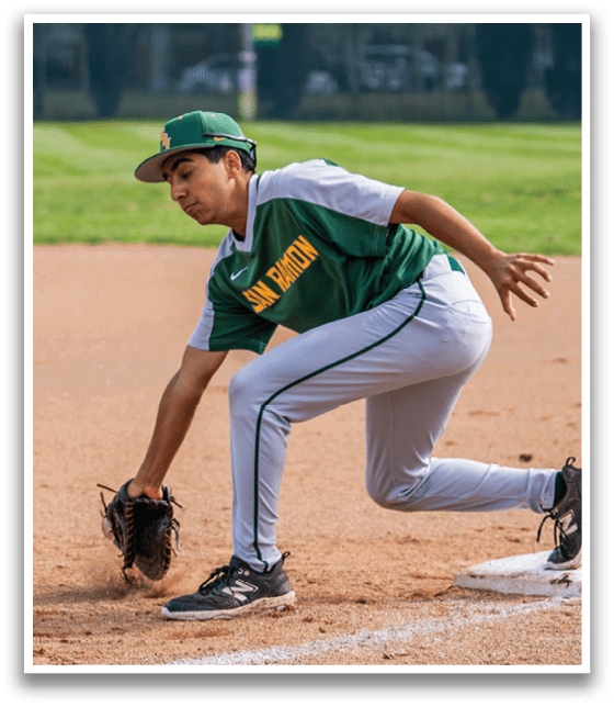A baseball player in a green and yellow uniform is sliding into a base. AI generated content