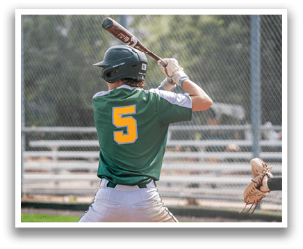 A baseball player in a green and yellow uniform is swinging a bat at a ball. AI generated content