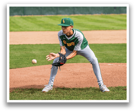 A baseball player in a green and yellow uniform is catching a ball on a baseball field. AI generated content