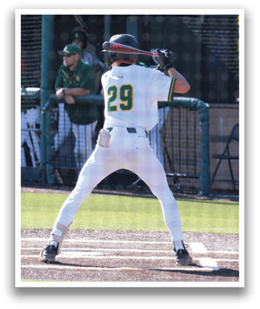 A baseball player is at bat, holding a bat and waiting for the pitch. AI generated content