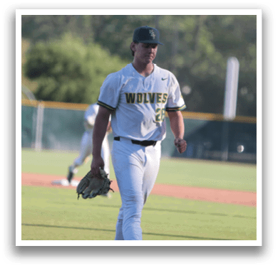 A baseball player wearing a white uniform and a black hat walks on the field. AI generated content