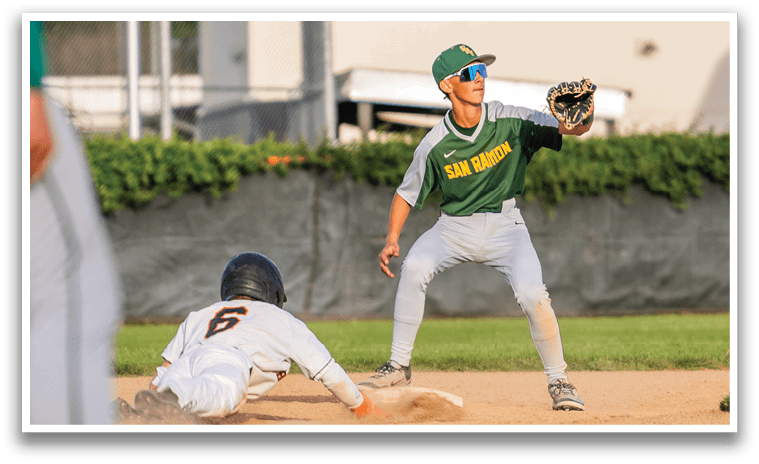 A baseball player is sliding into a base while another player is trying to catch the ball. AI generated content