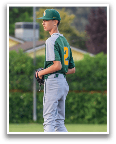 A baseball player wearing a green and yellow jersey stands on a field. AI generated content