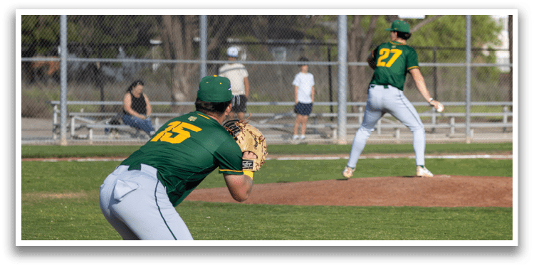 A baseball player in a green and yellow uniform is holding a catcher's mitt, ready to catch the ball. AI generated content