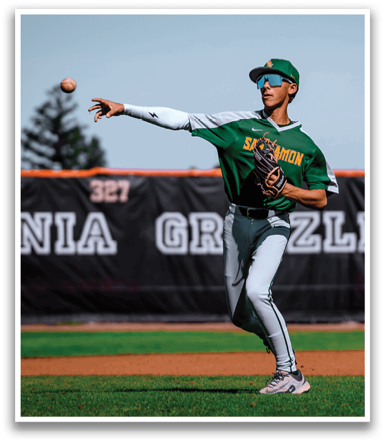 A baseball player in a green and white uniform is throwing a ball. AI generated content
