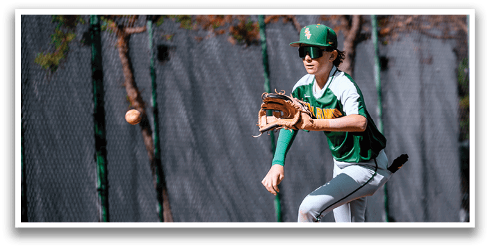 A baseball player in a green and white uniform is running towards a ball. AI generated content