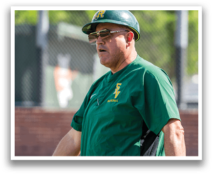 A man wearing a green shirt and a baseball cap is standing on a baseball field. AI generated content