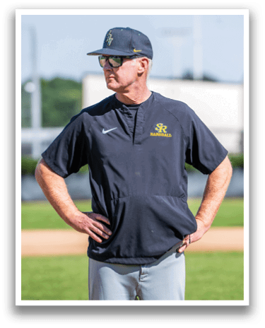 A man wearing a baseball jersey and sunglasses is standing on a baseball field. AI generated content