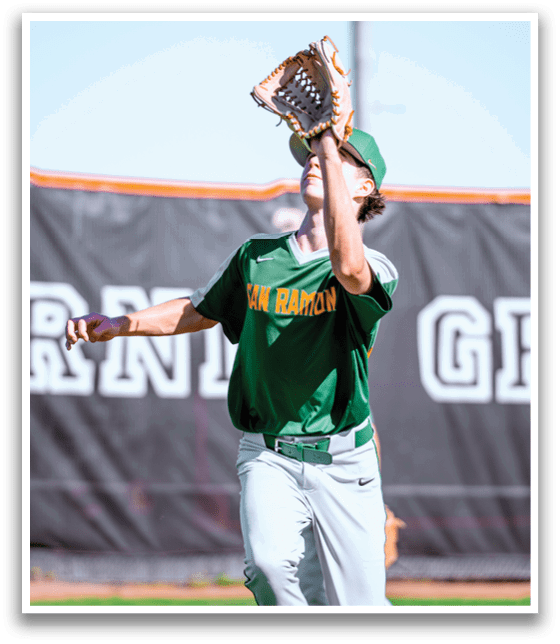 A baseball player wearing a green shirt and hat catches a ball with his glove. AI generated content