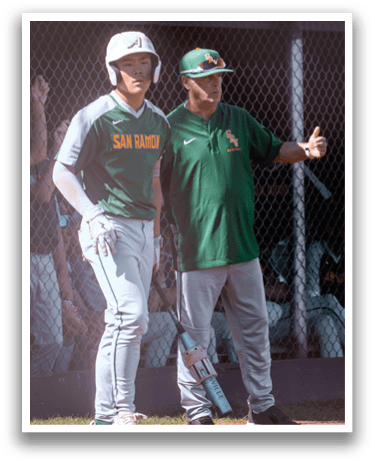 A man wearing a baseball uniform stands next to a man in a green and yellow shirt. AI generated content