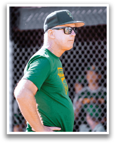 A man wearing a green shirt and sunglasses is standing on a field. AI generated content