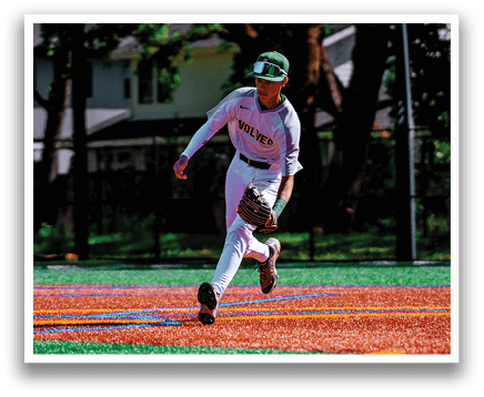 A baseball player in a white uniform is running towards a base. Description generated by AI