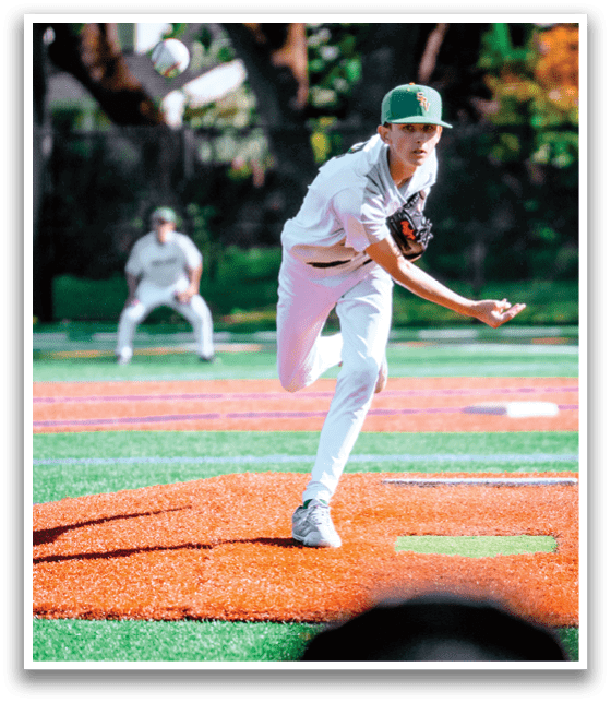 A baseball player in a white uniform is throwing a ball. Description generated by AI