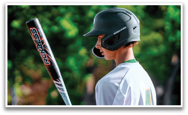 A baseball player holding a bat. Description generated by AI