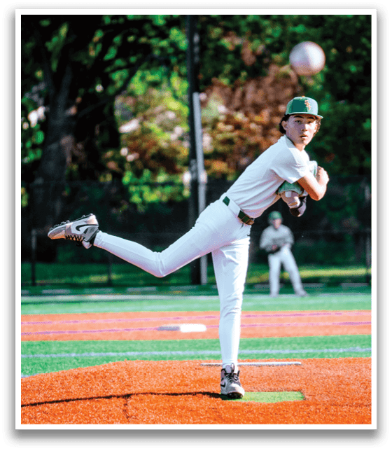 A baseball player in a white uniform is pitching a ball. Description generated by AI
