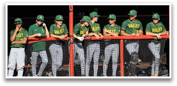 Baseball players wearing green and yellow jerseys. Description generated by AI