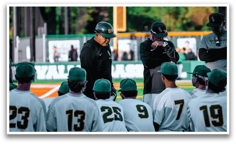 Baseball players wearing green and white uniforms. Description generated by AI