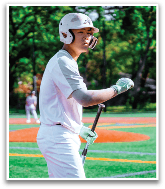 A baseball player holding a bat. Description generated by AI