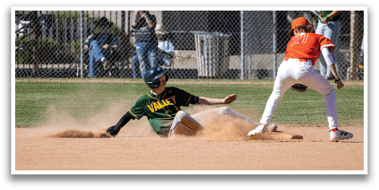 A baseball player slides into a base. Description generated by AI