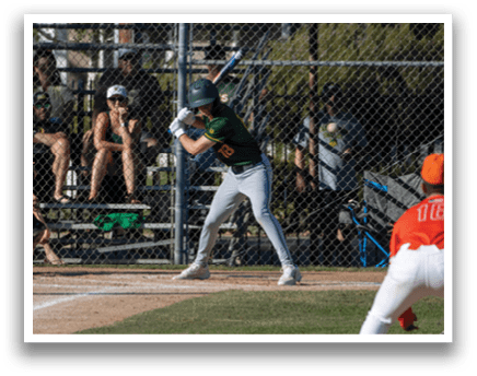 A baseball player is swinging a bat at a ball. Description generated by AI