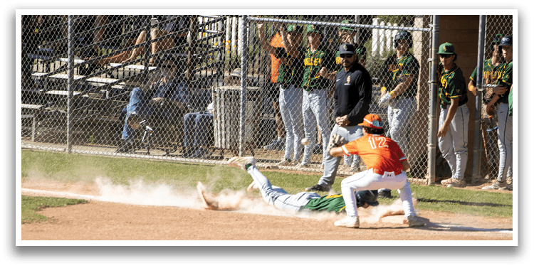 A baseball player slides into a base. Description generated by AI