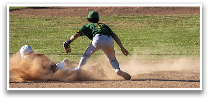 A baseball player slides into a base. Description generated by AI