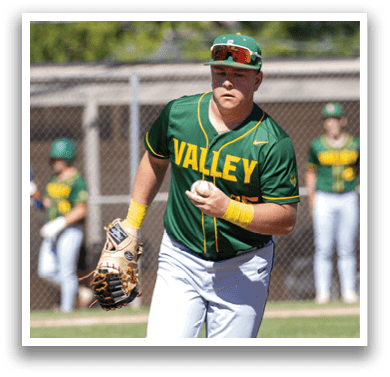 A baseball player wearing a green and yellow jersey is running on the field. Description generated by AI