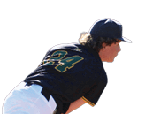 A baseball player in a black shirt and white pants is pitching a ball. Description generated by AI