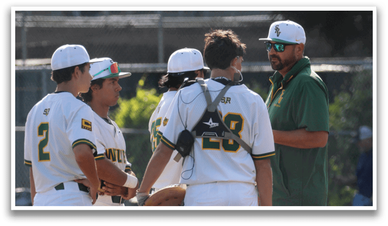 A group of baseball players wearing white uniforms and green and yellow shirts. Description generated by AI