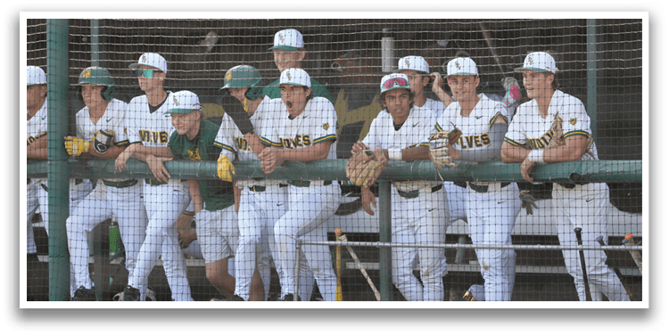 A group of baseball players sitting on a bench. Description generated by AI