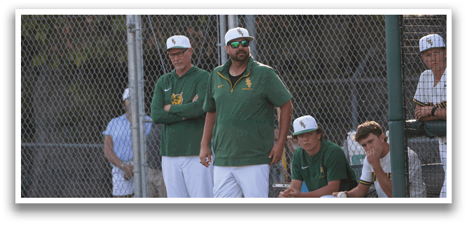 A group of men wearing green and white uniforms. Description generated by AI