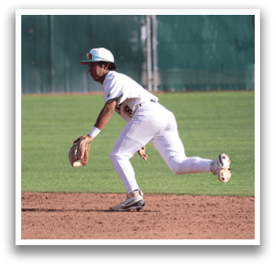 A baseball player in a white uniform is running on the field. Description generated by AI