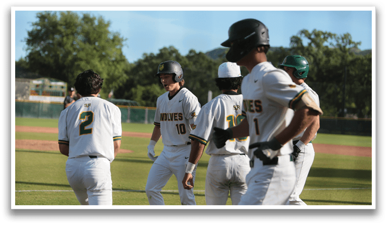 A group of baseball players wearing white uniforms. Description generated by AI