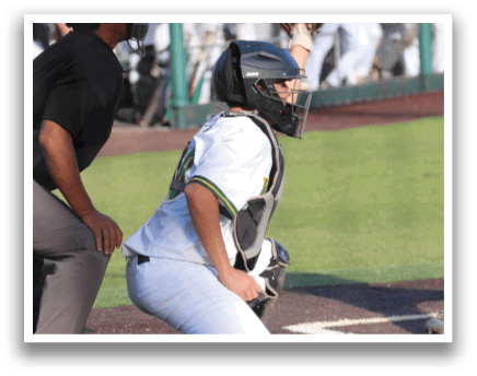 A baseball player is crouching down in the dirt. Description generated by AI