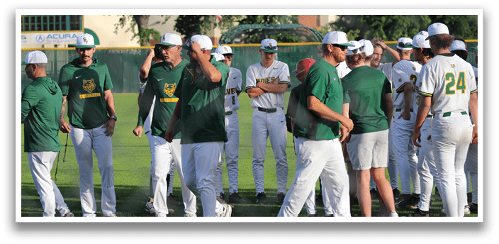 A group of baseball players wearing green and white uniforms. Description generated by AI