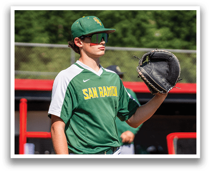 A baseball player wearing a green and white jersey with the word San Ramon on it. Description generated by AI