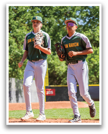 Two baseball players walking on the field. Description generated by AI