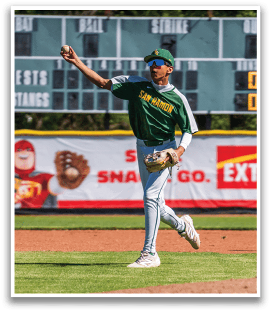 A baseball player wearing a green and white uniform. Description generated by AI