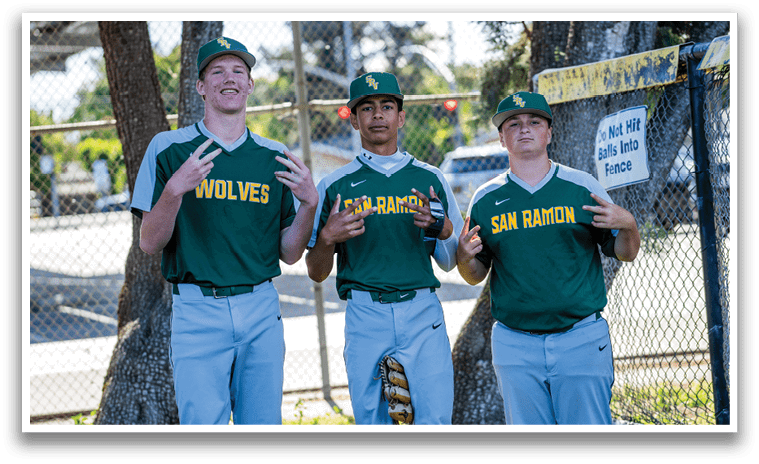 Three men wearing green and yellow shirts. Description generated by AI