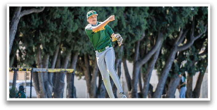 A baseball player in a green and yellow shirt is throwing a ball. Description generated by AI