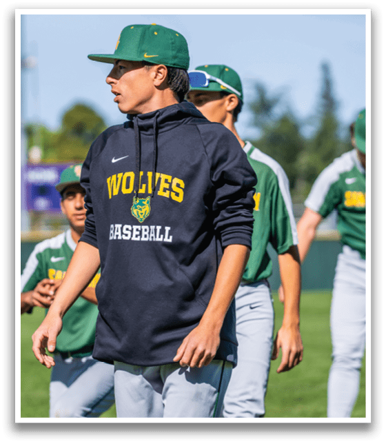 A man wearing a black hoodie with the word wolves on it. Description generated by AI