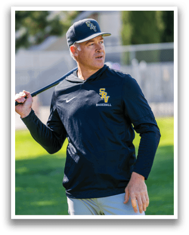 A man holding a baseball bat. Description generated by AI