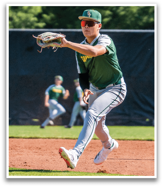 A baseball player in a green and white uniform is running on the field. Description generated by AI