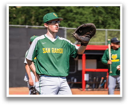 A man wearing a green and yellow shirt and holding a baseball glove. Description generated by AI