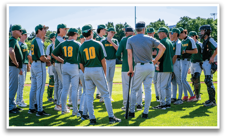 A group of baseball players standing on a field. Description generated by AI