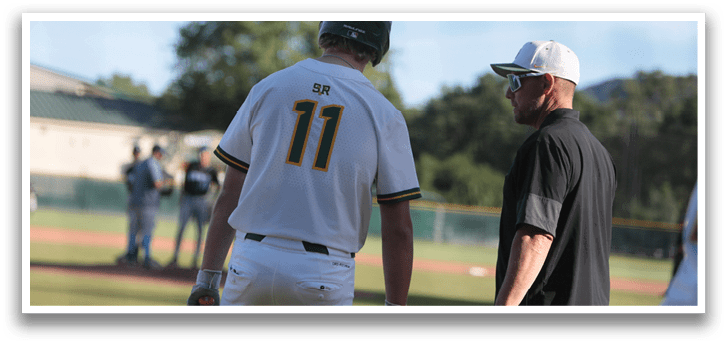 A baseball player wearing a white uniform with the number 11 on the back. Description generated by AI
