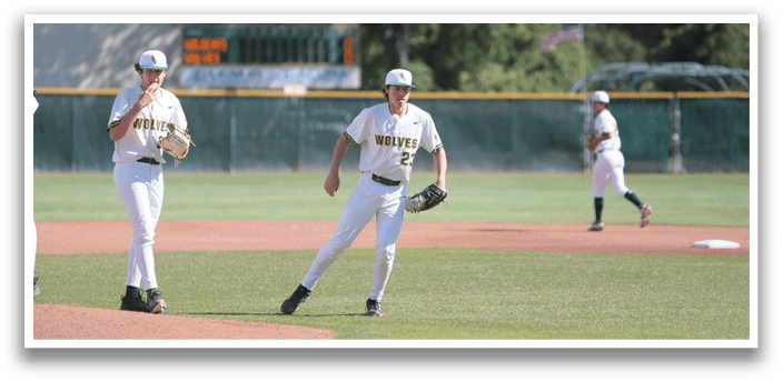 A baseball field with a group of men playing baseball. Description generated by AI