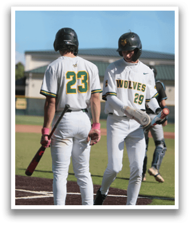 Two baseball players standing on a field. Description generated by AI